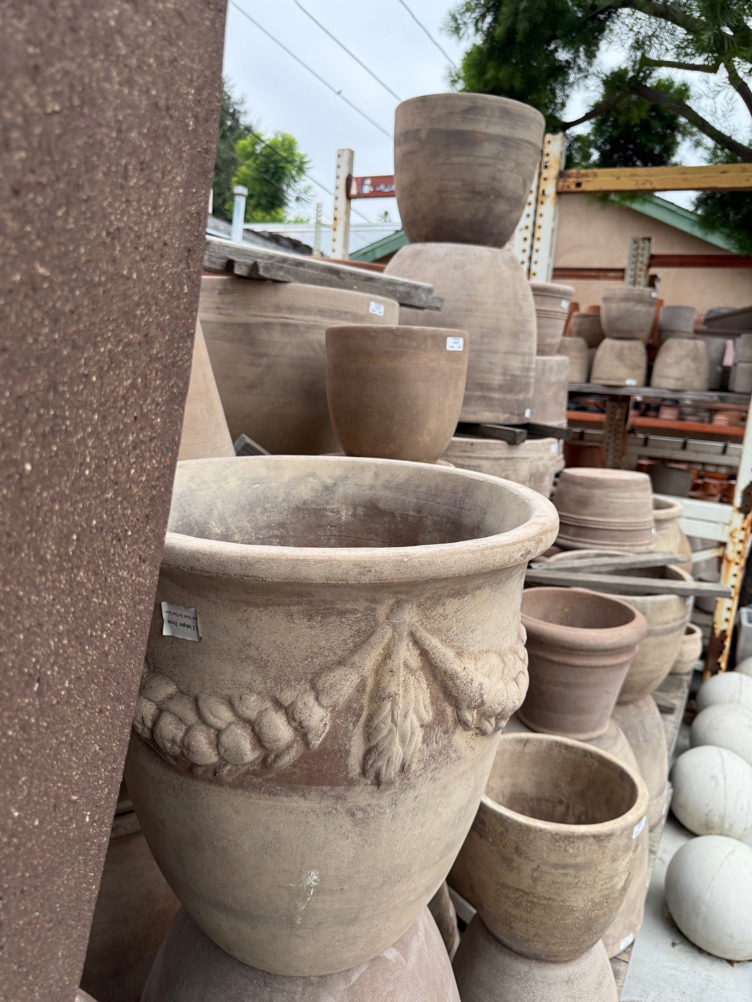 Earth-toned and traditional planters at Lincoln Avenue Nursery